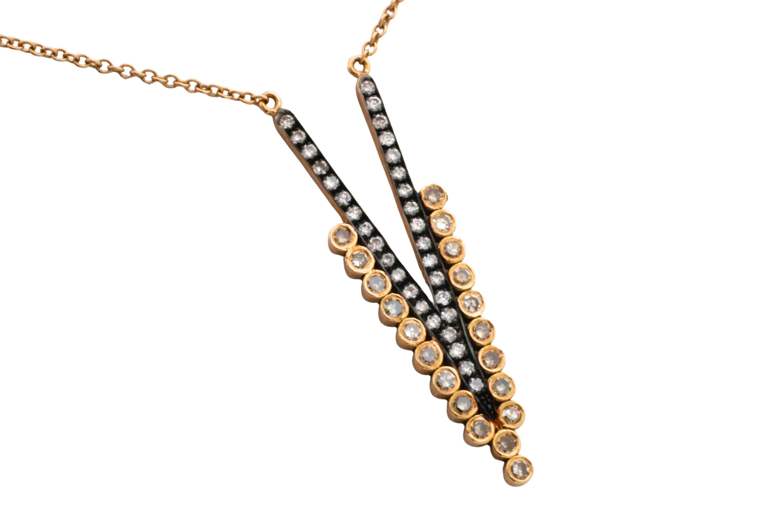 18 carat gold V pendant with diamonds
