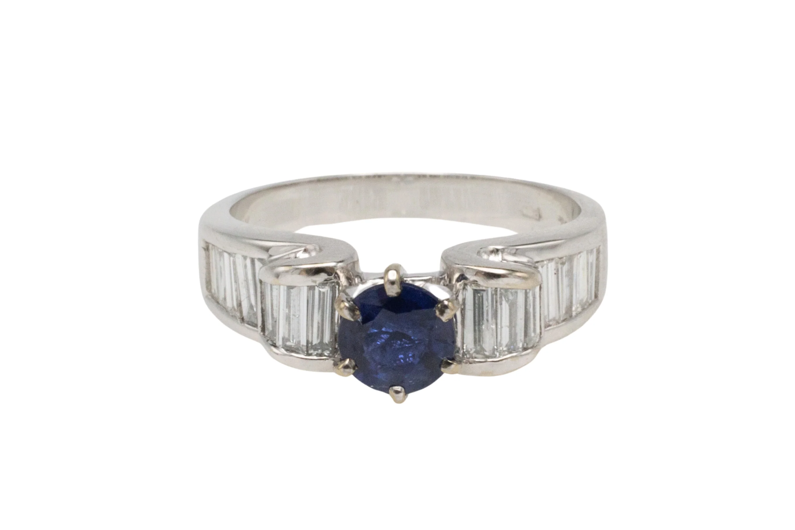 White gold ring with baguette diamonds and sapphire
